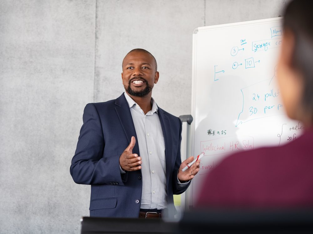 Manager leading a training session with staff